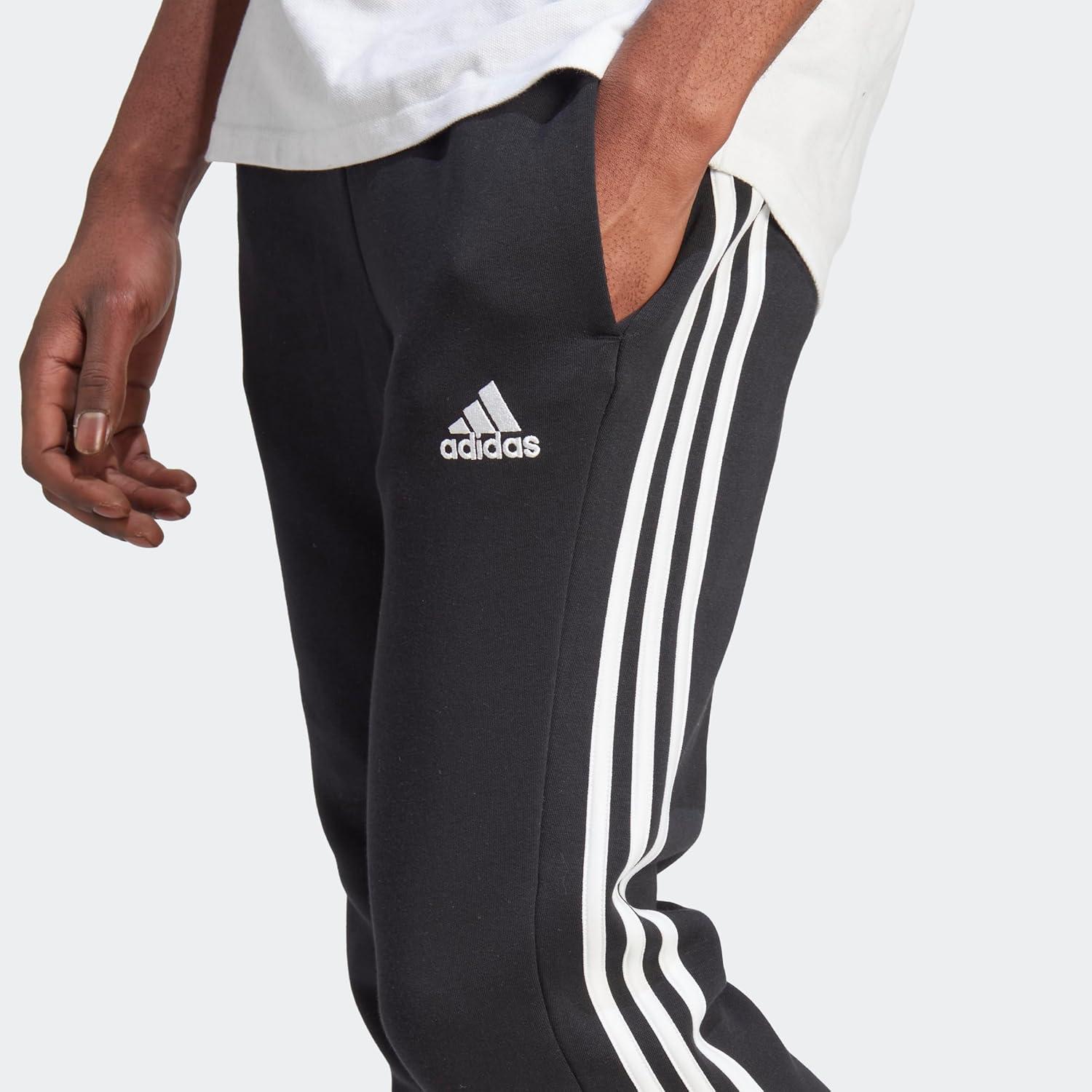 imageadidas Mens Essentials 3Stripes Fleece Tapered Cuff PantsBlack White