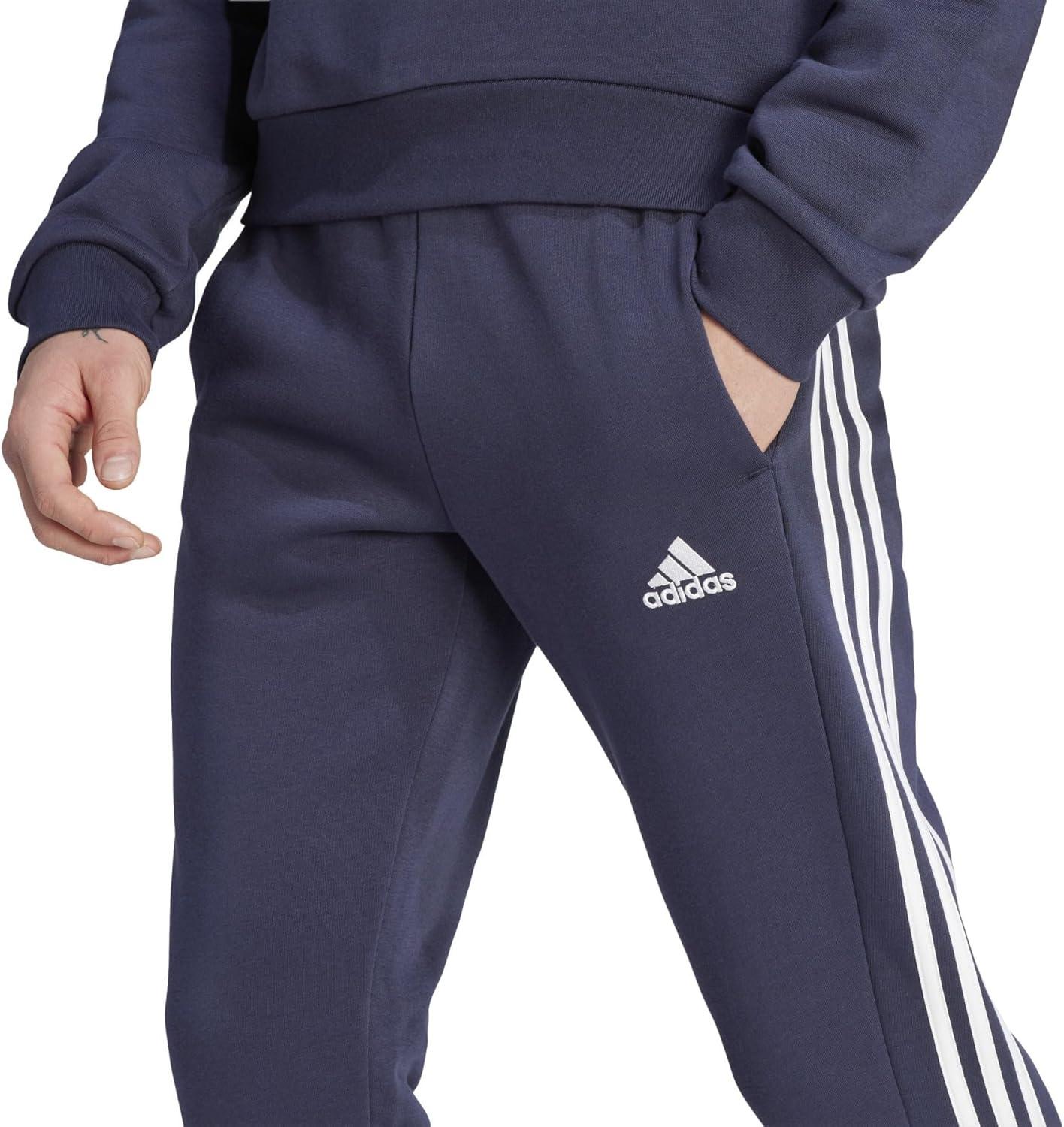 imageadidas Mens Essentials 3Stripes Fleece Tapered Cuff PantsLegend Ink