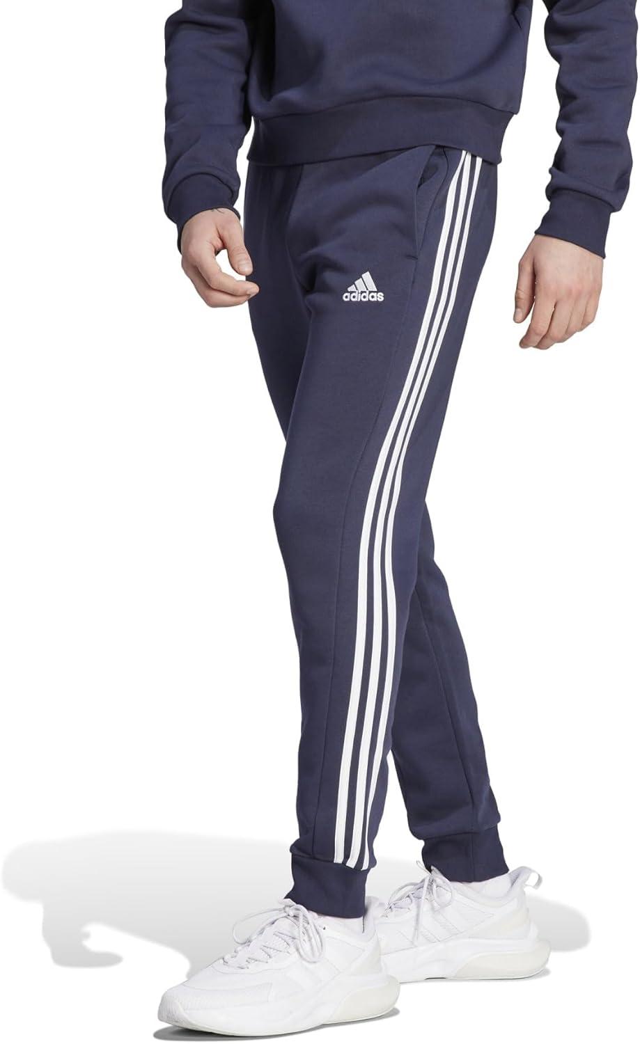 imageadidas Mens Essentials 3Stripes Fleece Tapered Cuff PantsLegend Ink