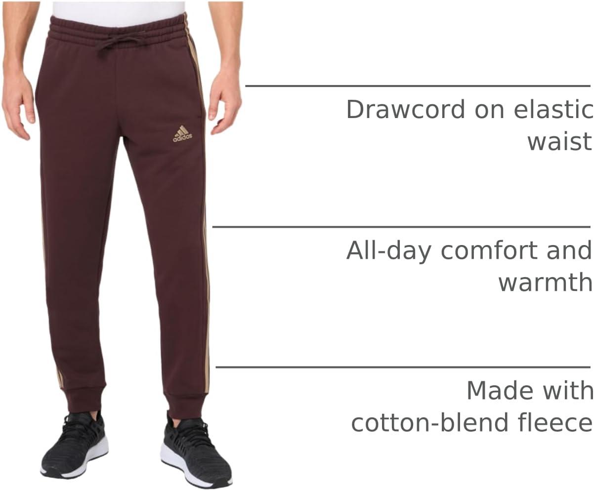 imageadidas Mens Essentials 3Stripes Fleece Tapered Cuff PantsShadow Brown