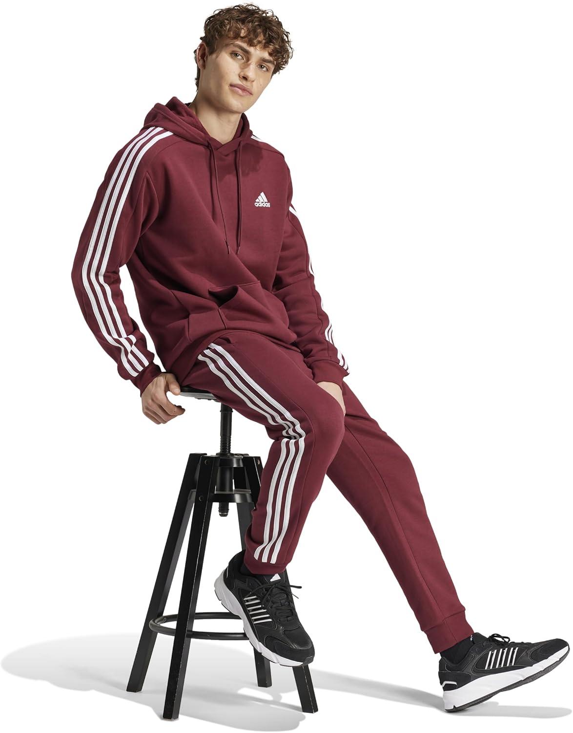 imageadidas Mens Essentials 3Stripes Fleece Tapered Cuff PantsShadow Red