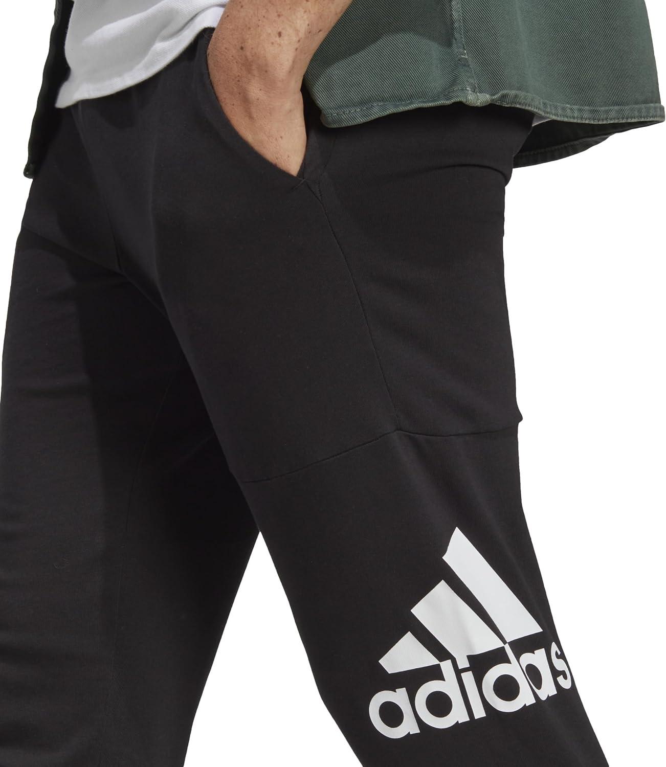 imageadidas Mens Essentials Logo Tapered Badge SweatpantsBlack