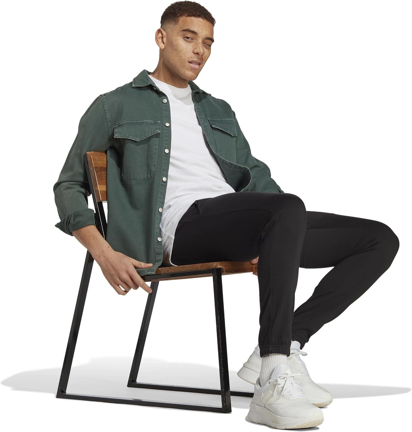 imageadidas Mens Essentials Logo Tapered Badge SweatpantsBlack