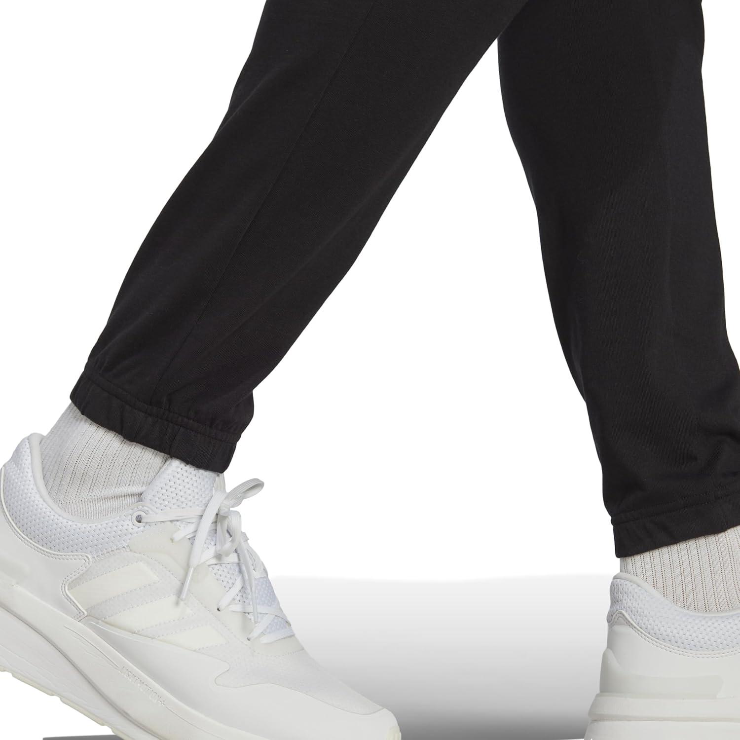 imageadidas Mens Essentials Logo Tapered Badge SweatpantsBlack