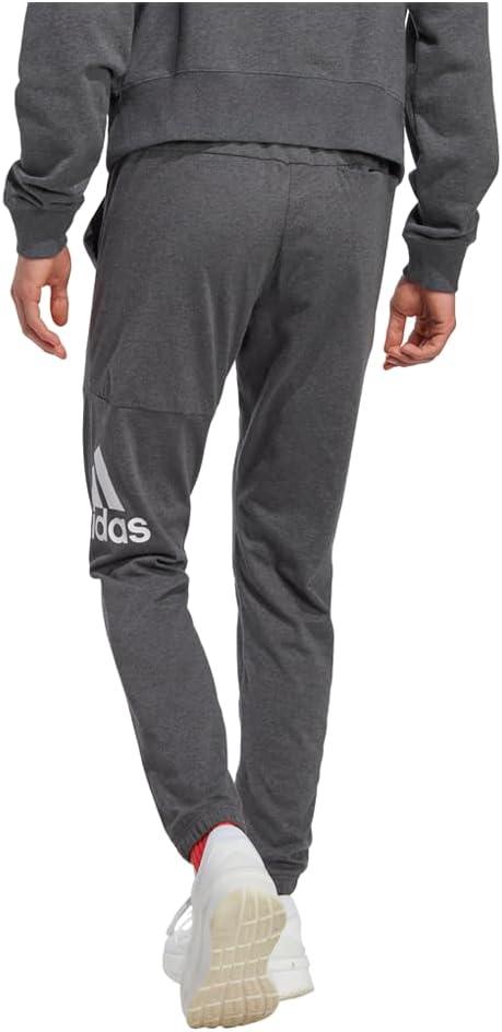 imageadidas Mens Essentials Logo Tapered Badge SweatpantsDark Grey Heather