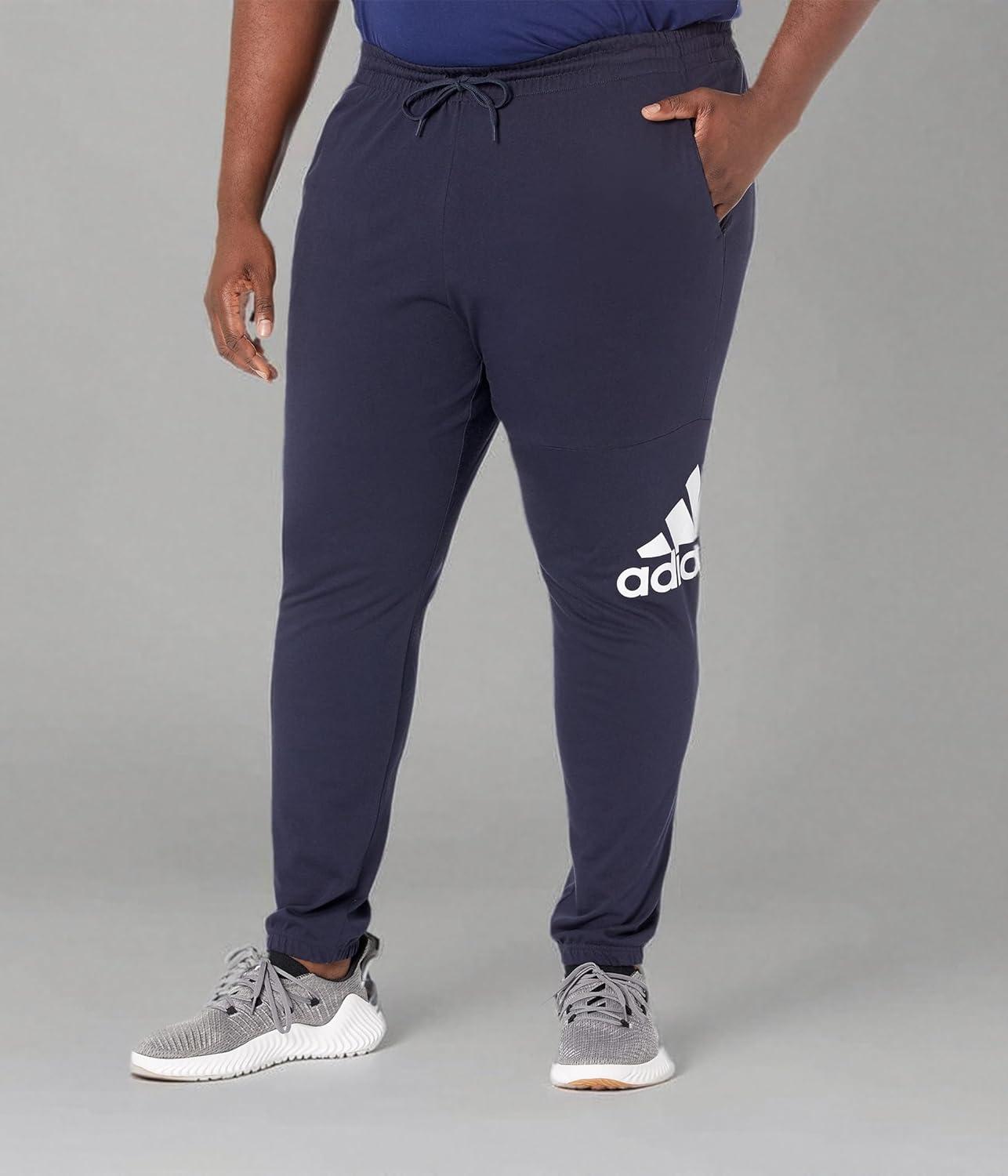 imageadidas Mens Essentials Logo Tapered Badge SweatpantsInk