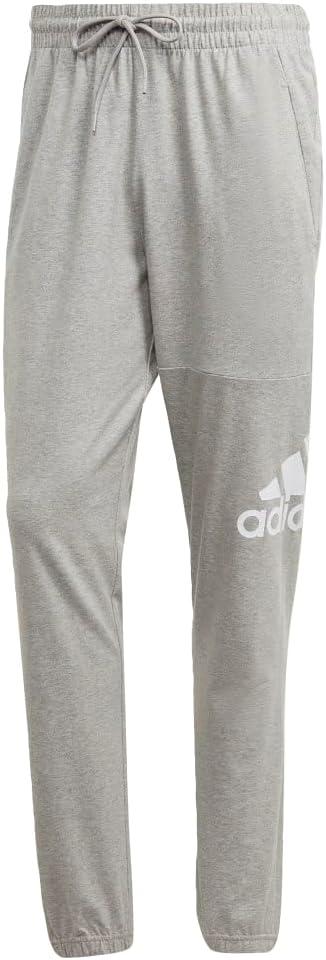 imageadidas Mens Essentials Logo Tapered Badge SweatpantsMedium Grey Heather