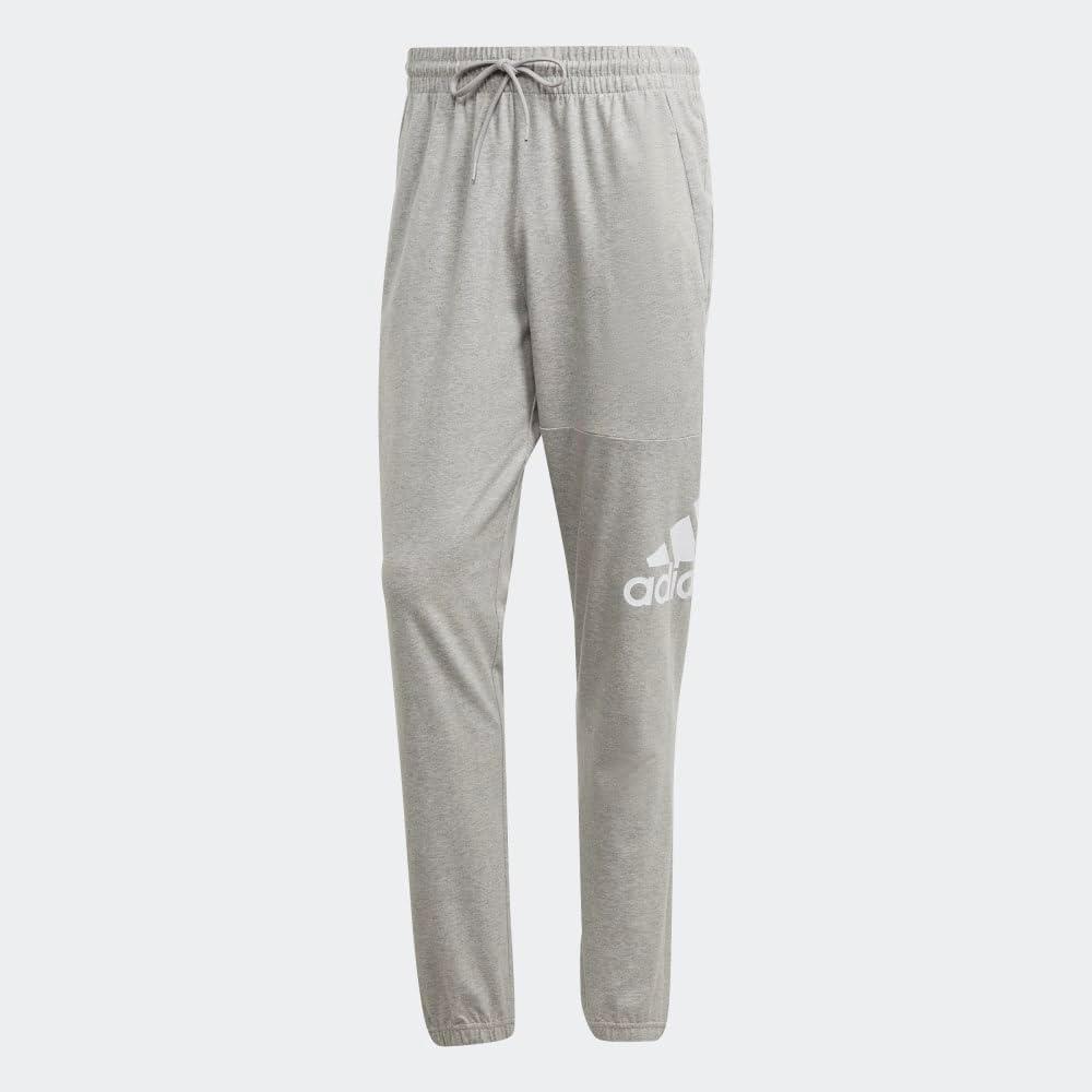 imageadidas Mens Essentials Logo Tapered Badge SweatpantsMedium Grey Heather